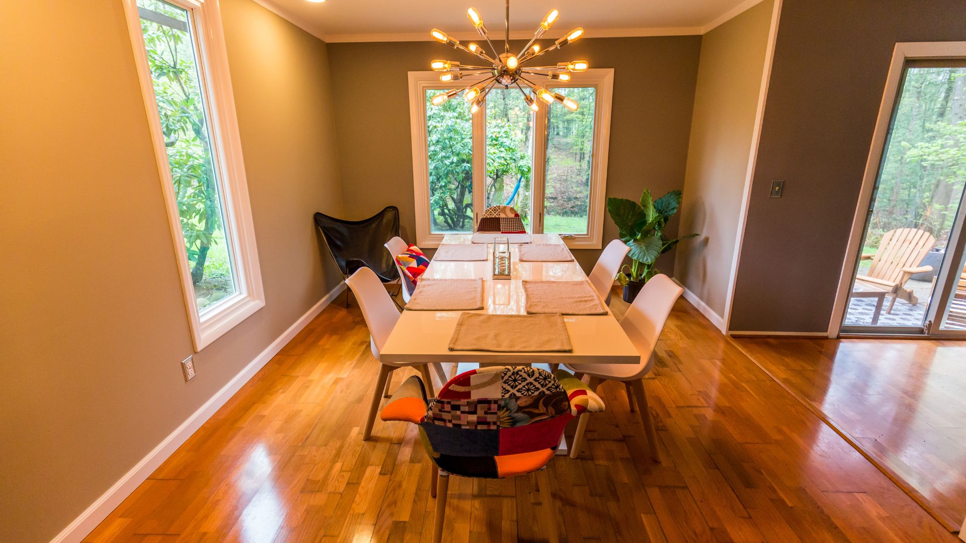 A dining room with a table and chairs