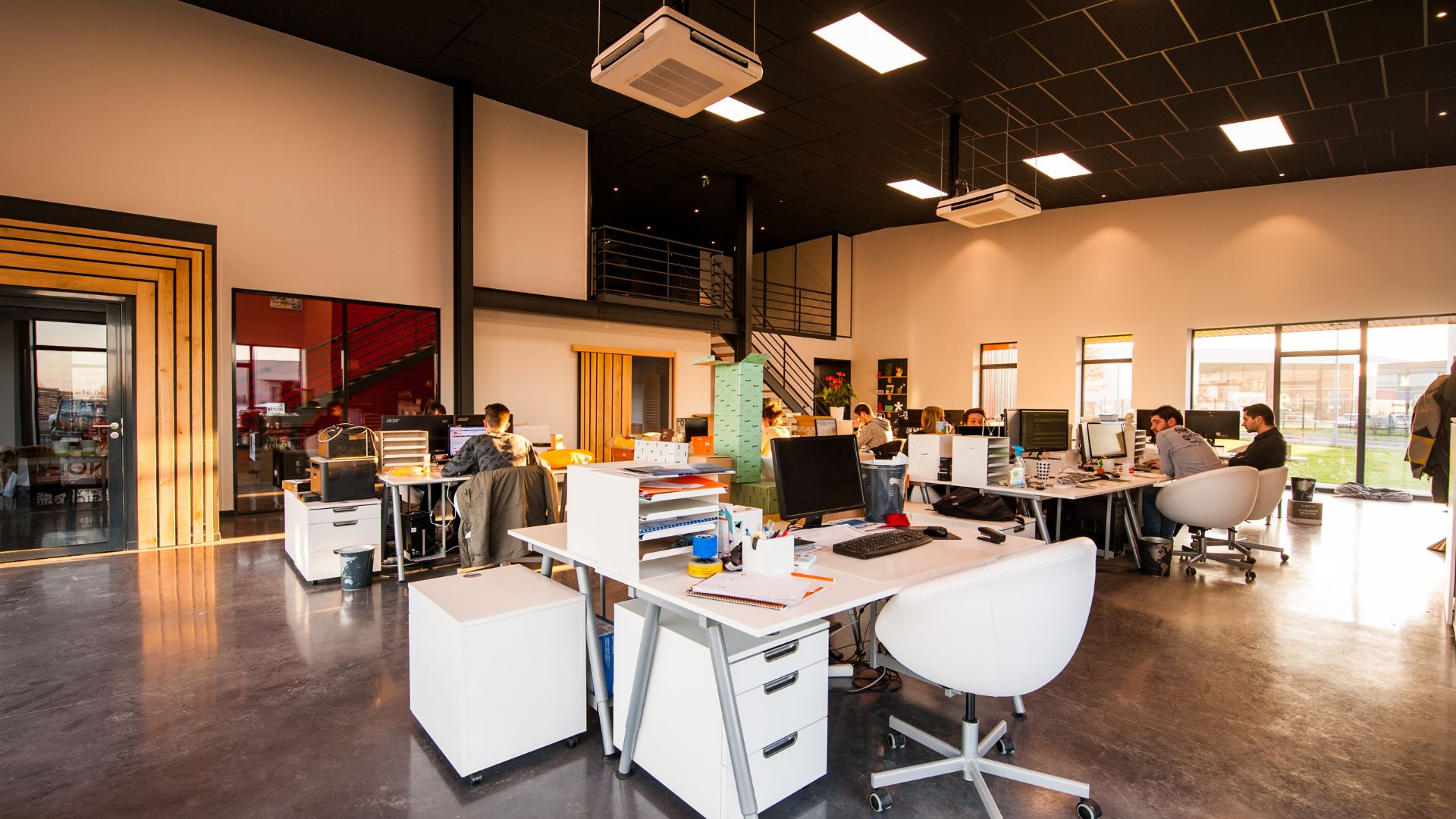 A group of people working at desks in an office